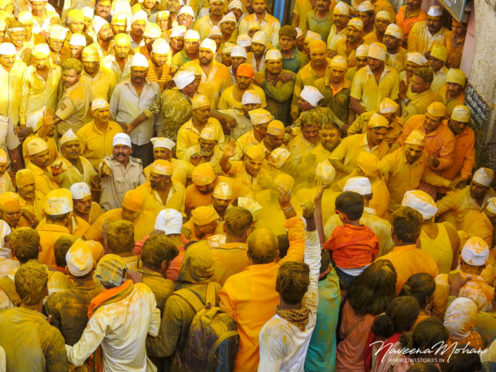 Huge crowd at Khandoba Temple. Turmeric being thrown from rooftops on the huge crowd